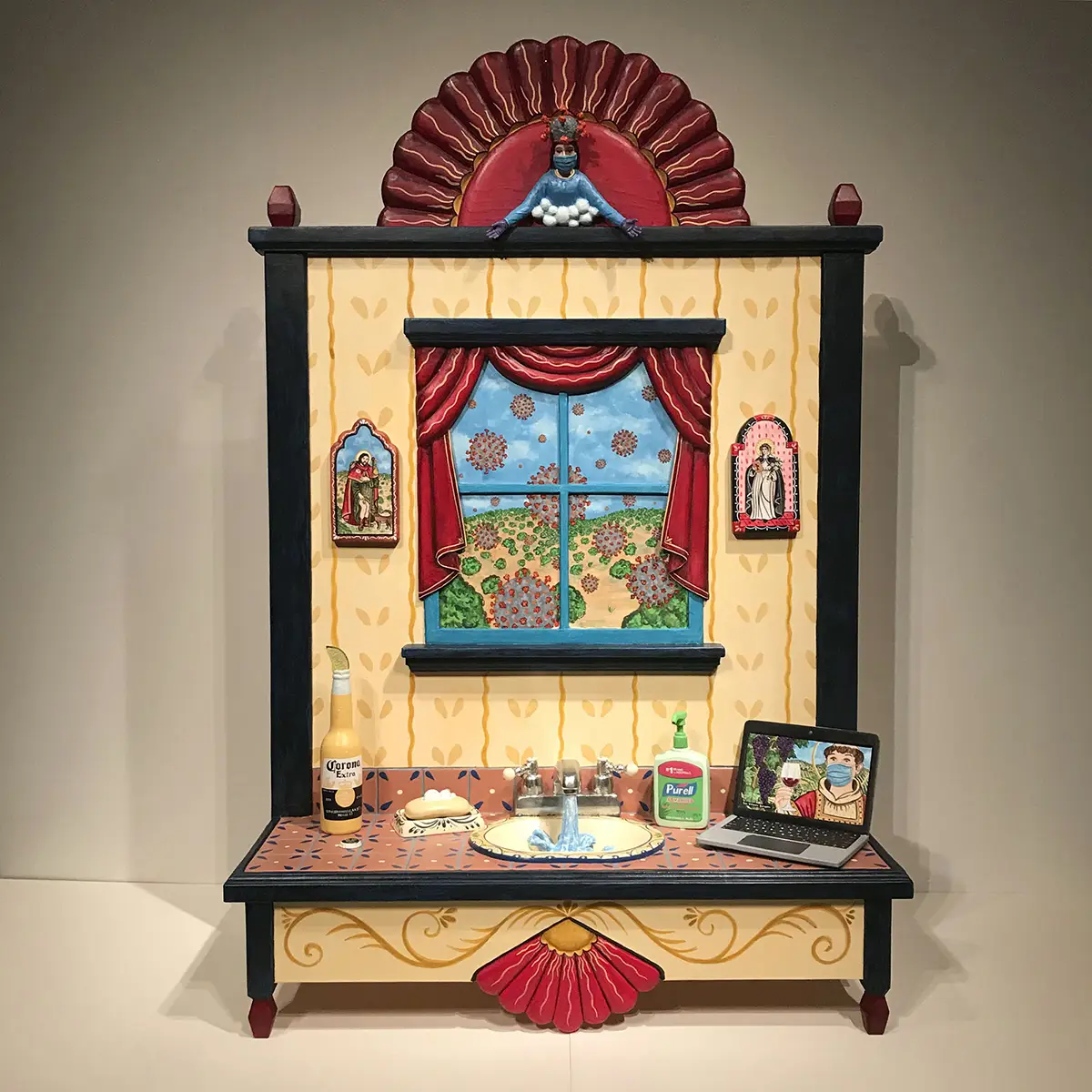 Painted wooden folk scene depicting life during COVID of a bathroom sink with Purell, a face-masked figure, virus imagery in the window, and saints.